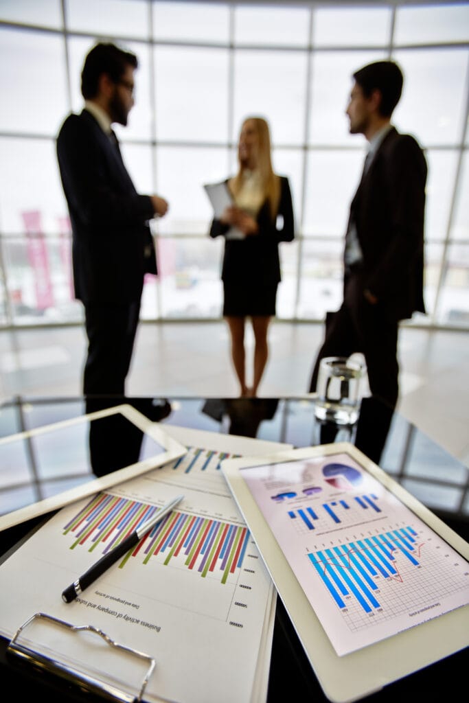 Workplace with objects statistical documents office table